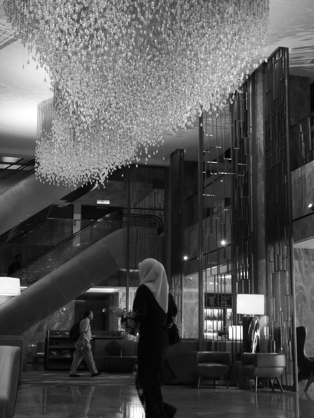 Business people talking in a modern lobby